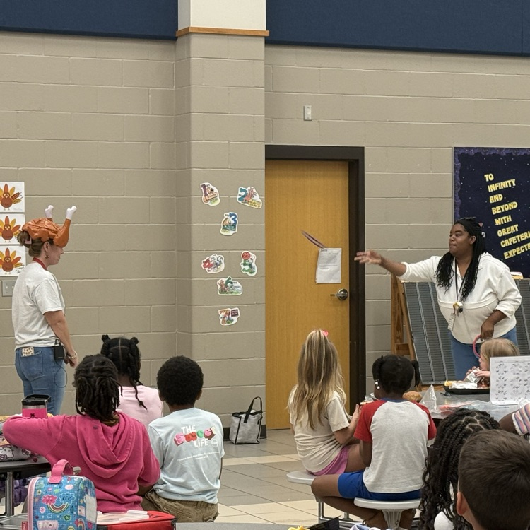 teachers throwing rings at woman’s turkey hat