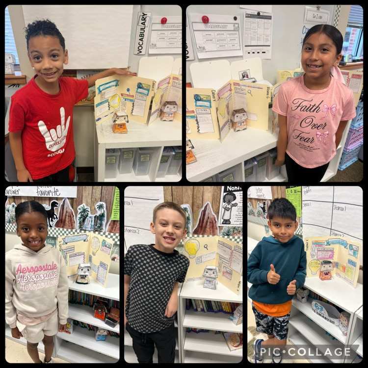 students posing with their bobblehead astronauts and file folder biographies 