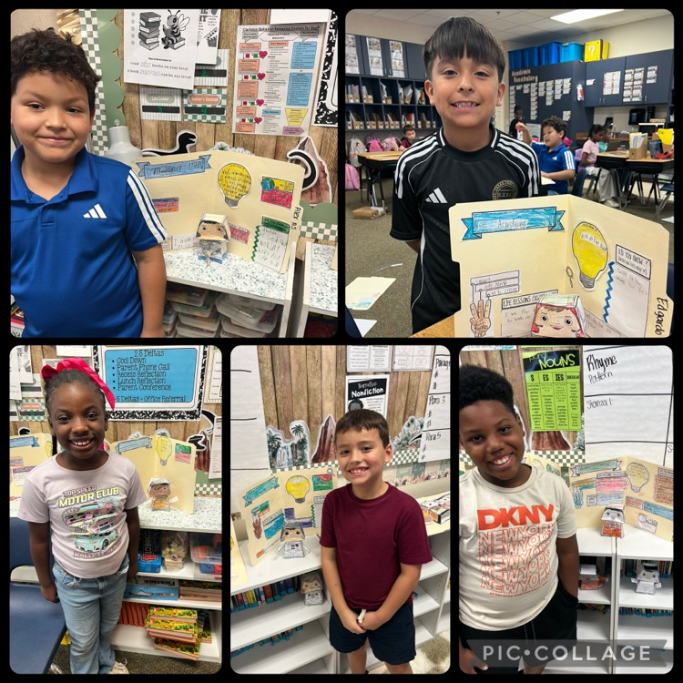 students posing with their bobblehead astronauts and file folder biographies 