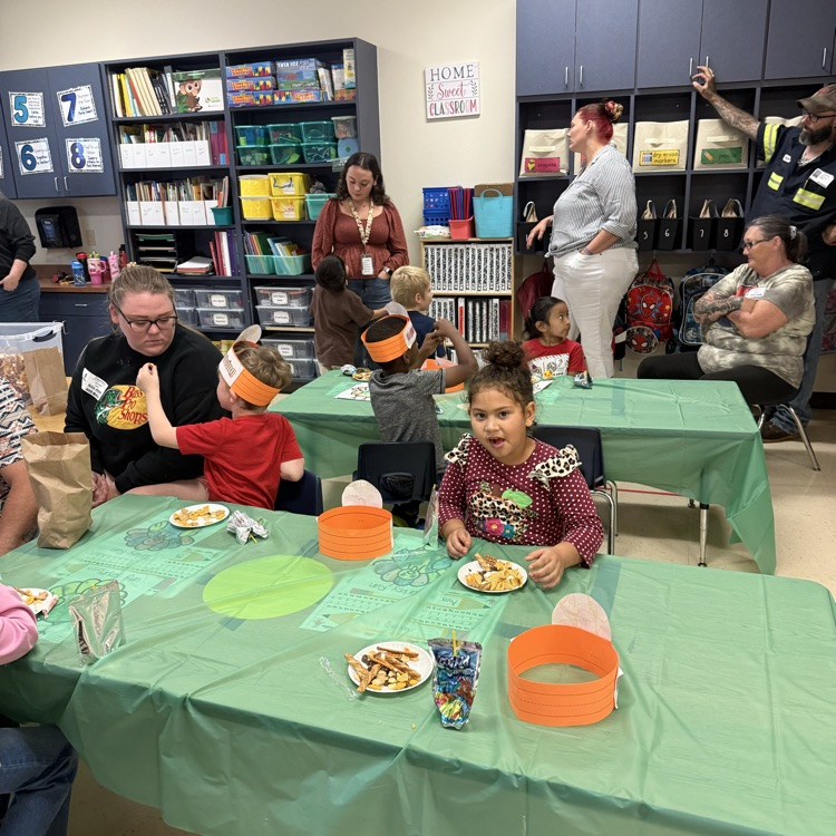 students eating trail mix at their tables