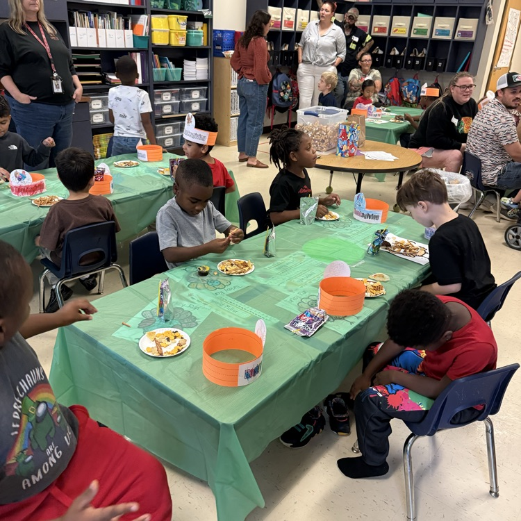 students eating trail mix at their tables