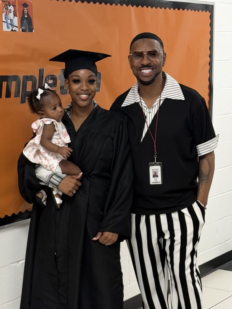 students posing with principal