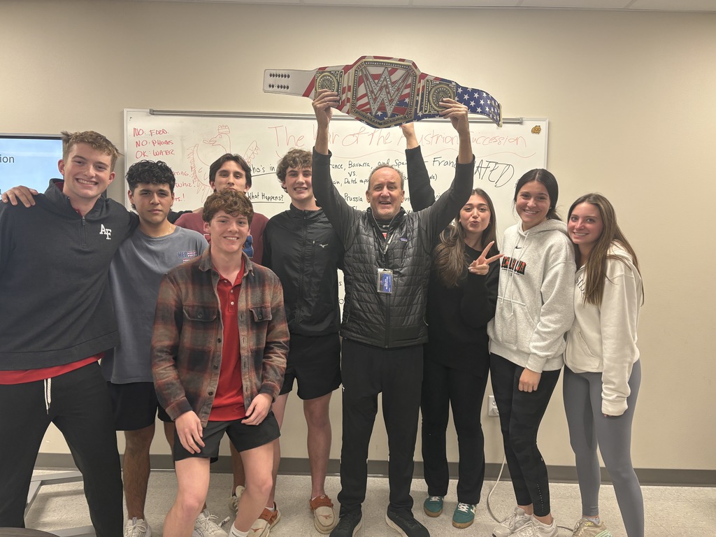 Coach Hesskew with his students and the Walk Through Wednesday belt