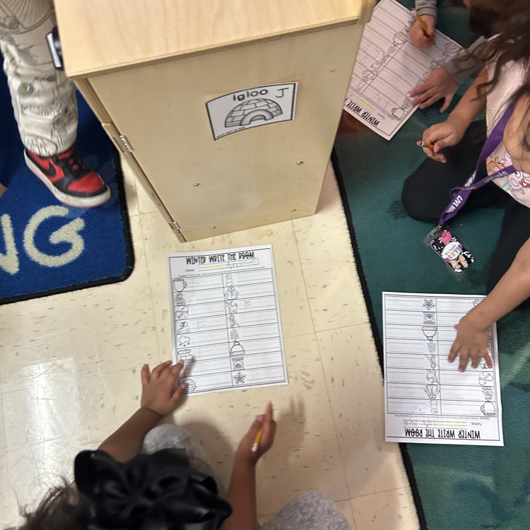 students working on riding winter words around the room