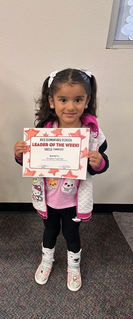 student holding a certificate