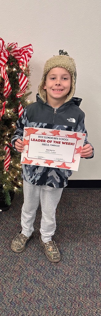 student holding a certificate