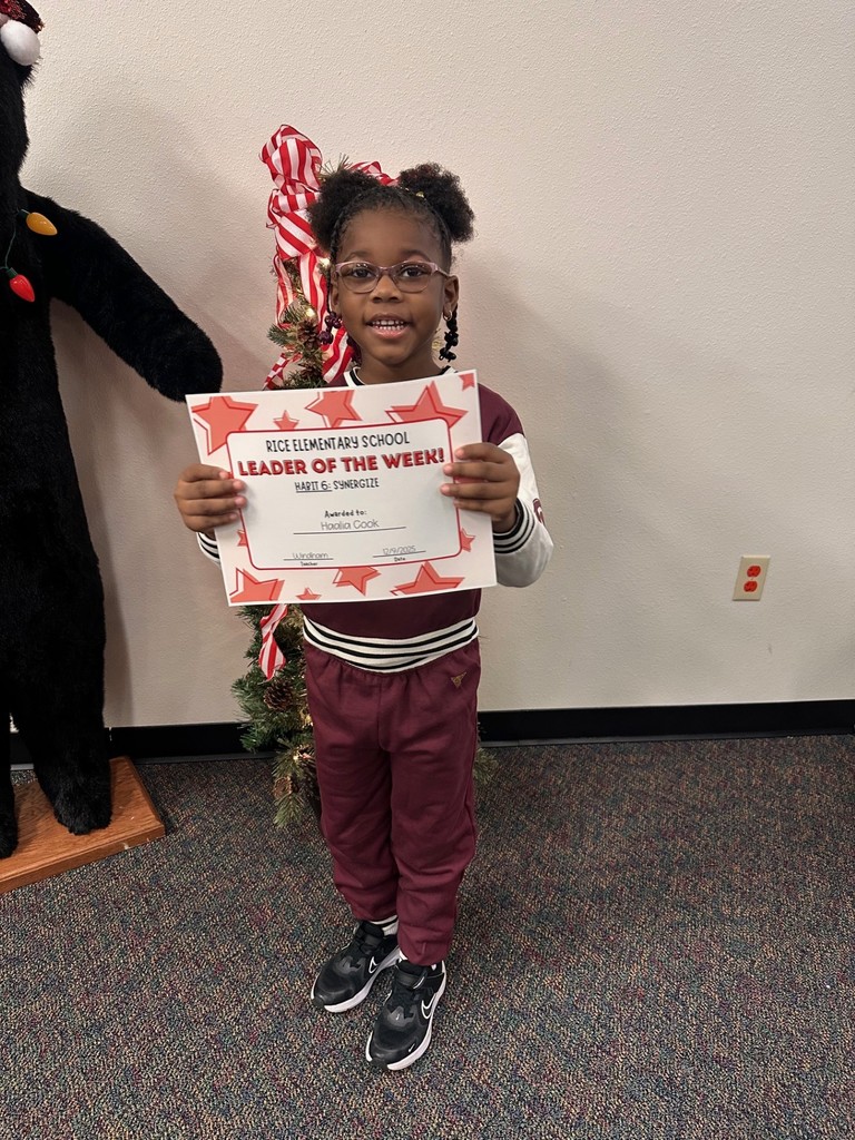 student holding a certificate