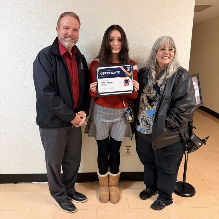 three people posing for a picture