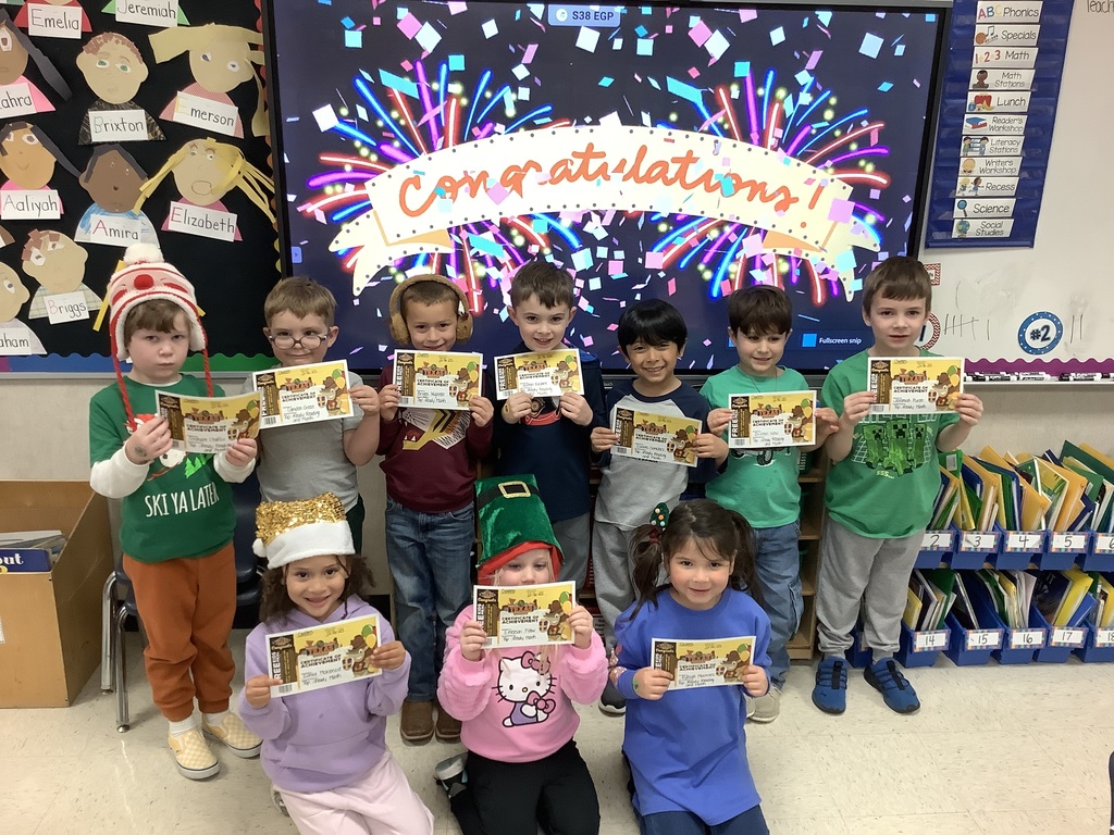 Students holding certificates.
