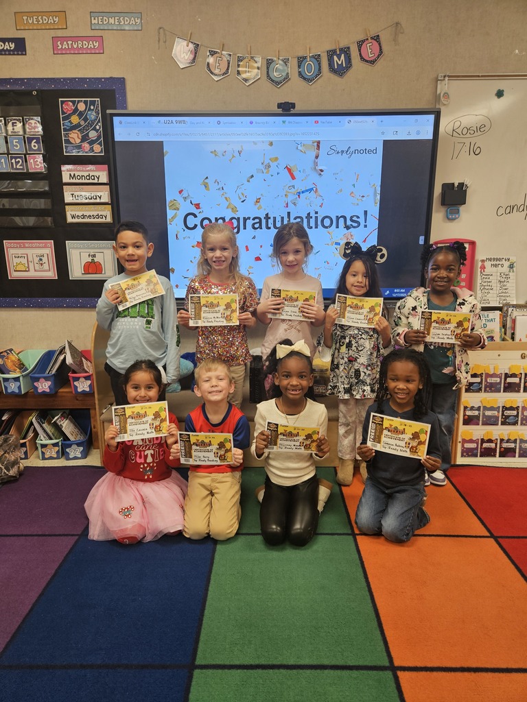 Students holding certificates.