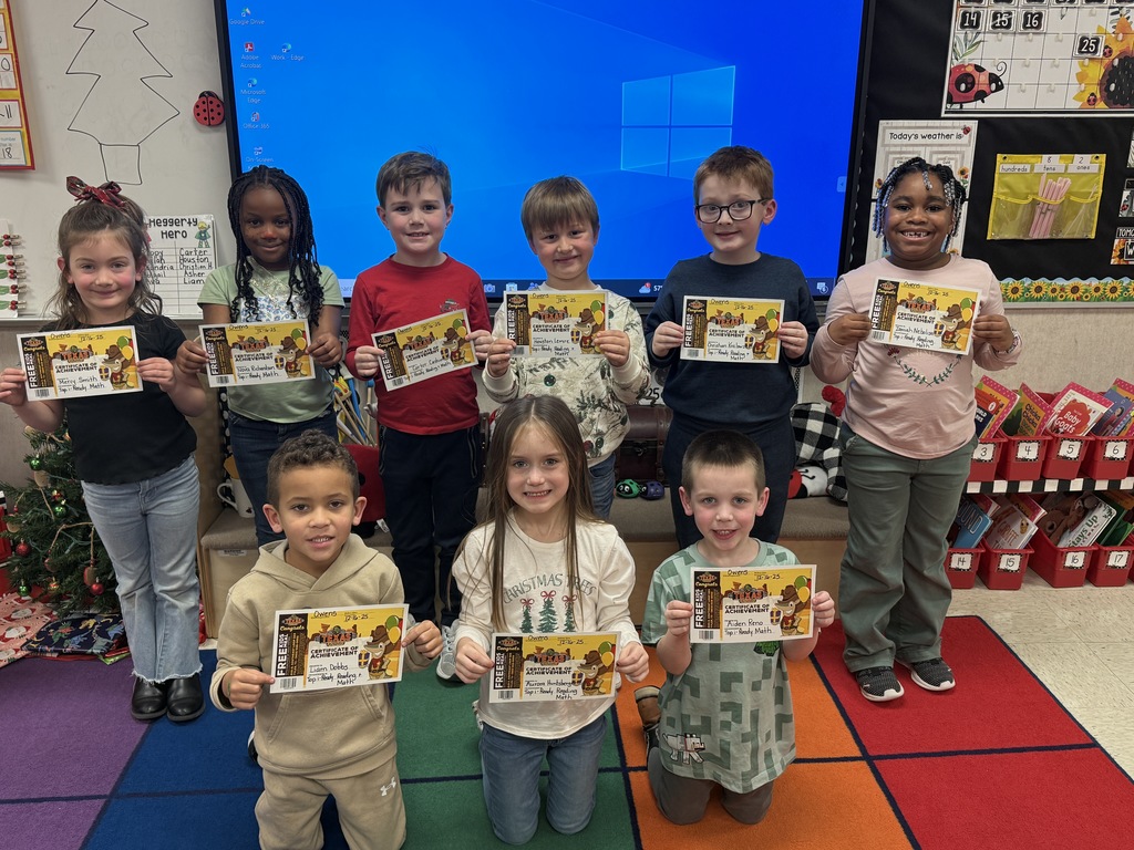 Students holding certificates.