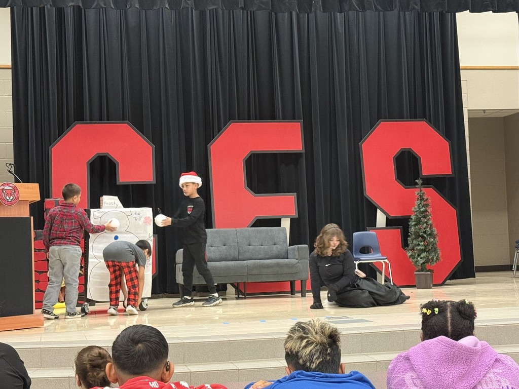 drama club performing a christmas play for a student audience