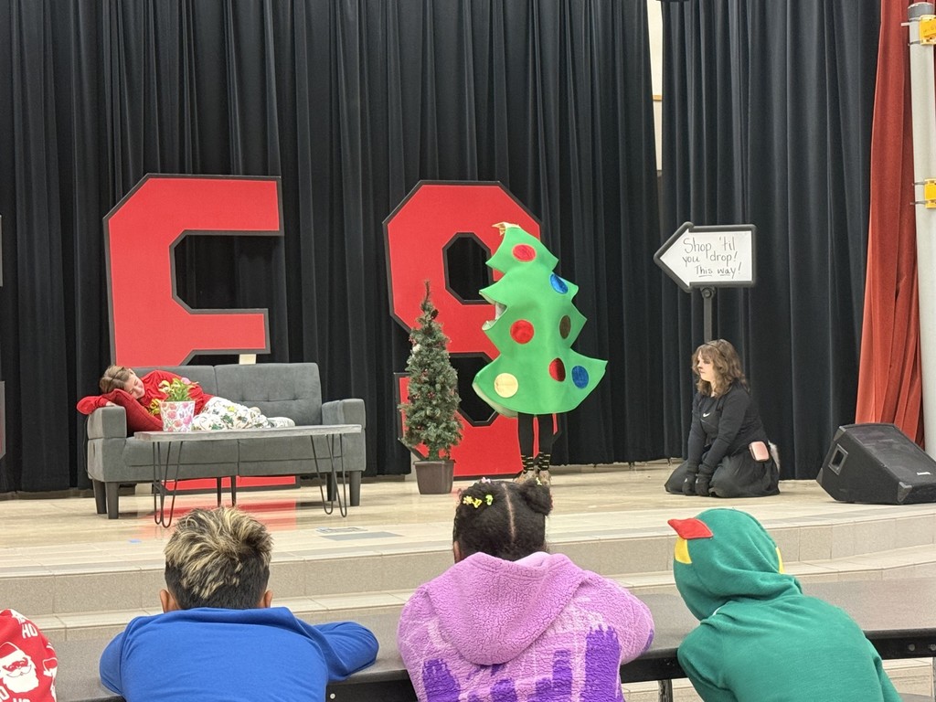 drama club performing a christmas play for a student audience