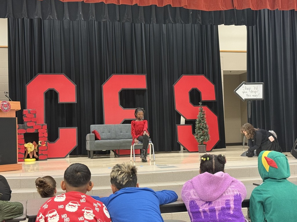 drama club performing a christmas play for a student audience