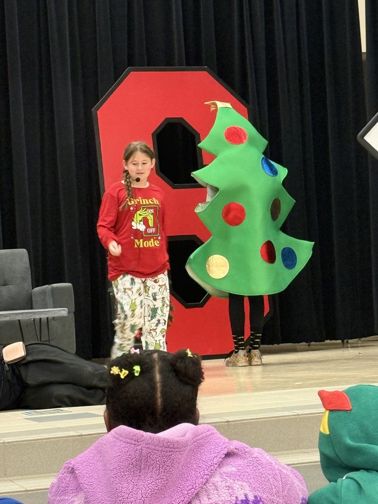 drama club performing a christmas play for a student audience