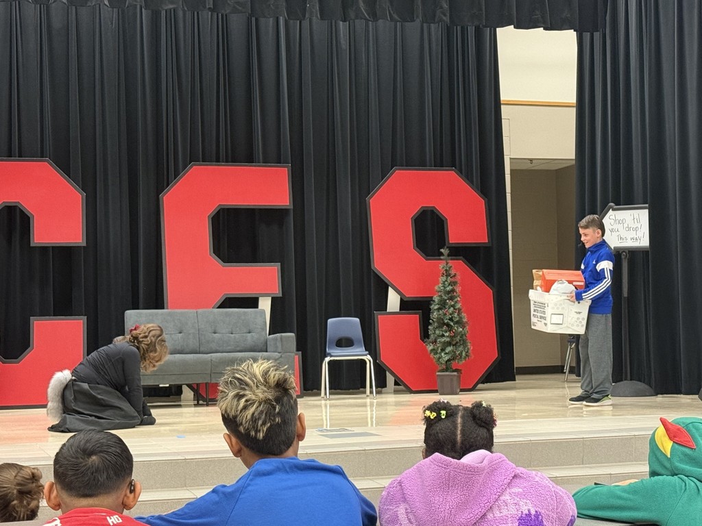 drama club performing a christmas play for a student audience