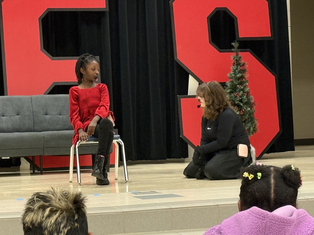 drama club performing a christmas play for a student audience