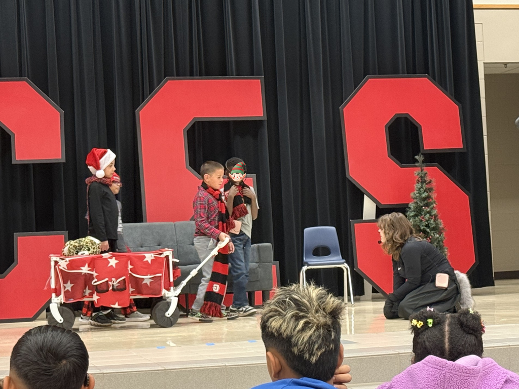 drama club performing a christmas play for a student audience