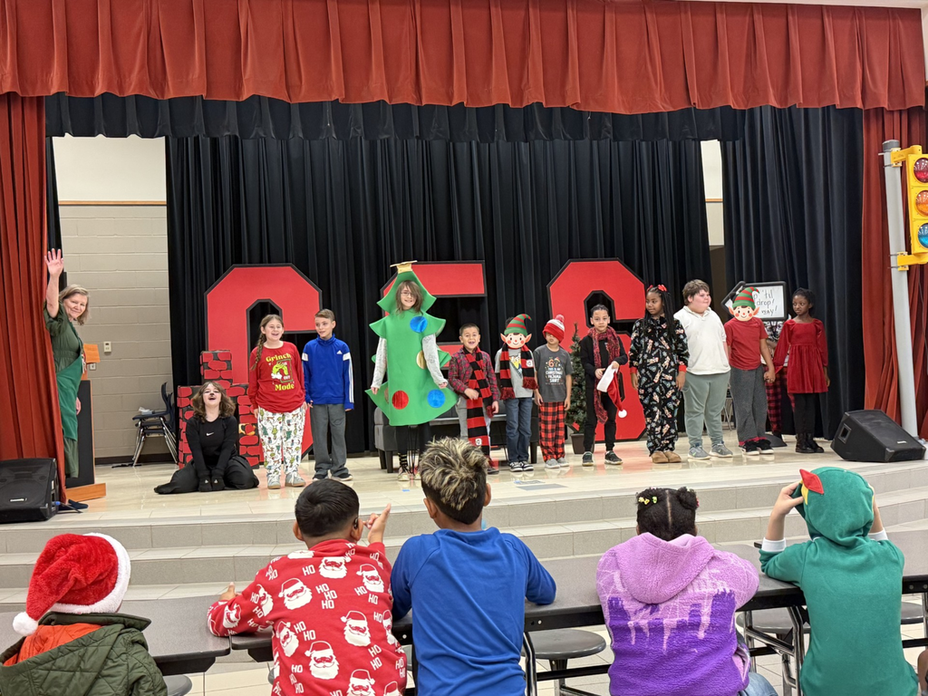 drama club performing a christmas play for a student audience