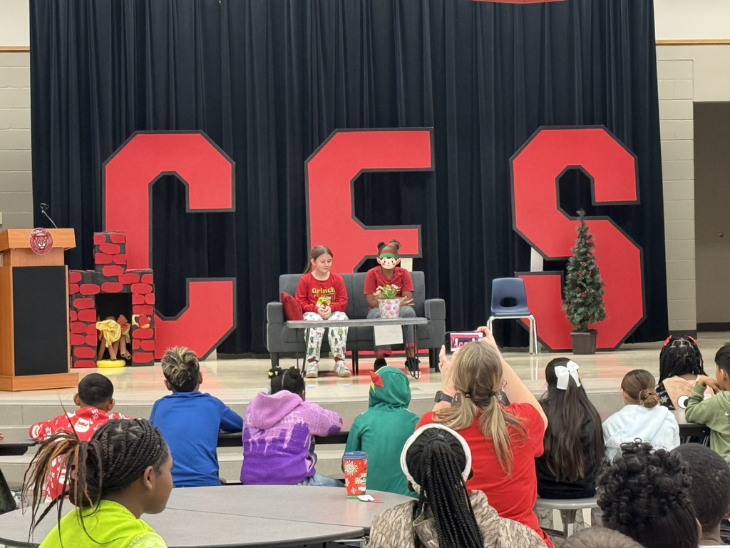 drama club performing a christmas play for a student audience