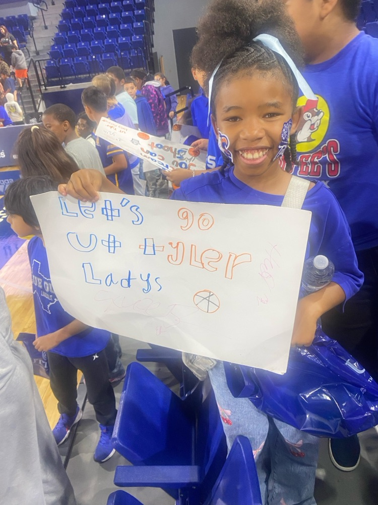 student holding sign