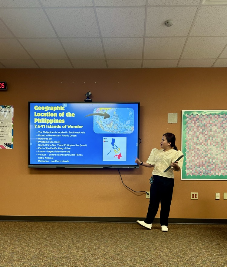 teacher presenting on the Philippines