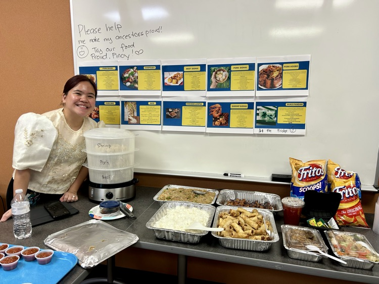 teacher smiling in front of food