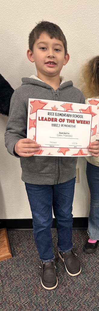 student holding a certificate