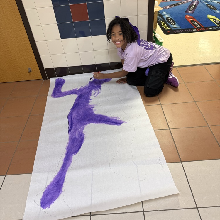students painting in the hallway