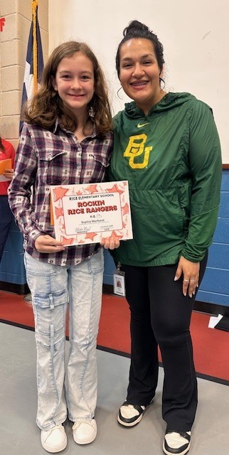 Student holding a certificate with teacher
