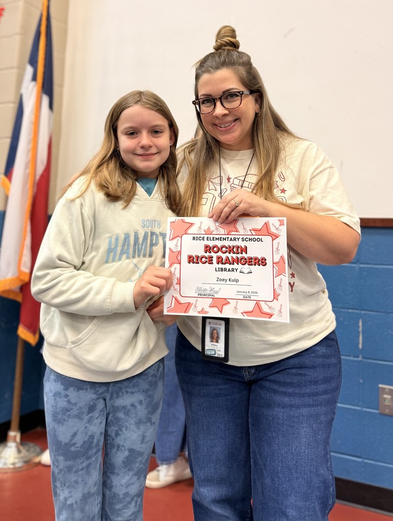 Student holding a certificate with teacher