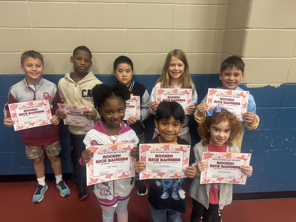 Students holding  certificates for i-ready