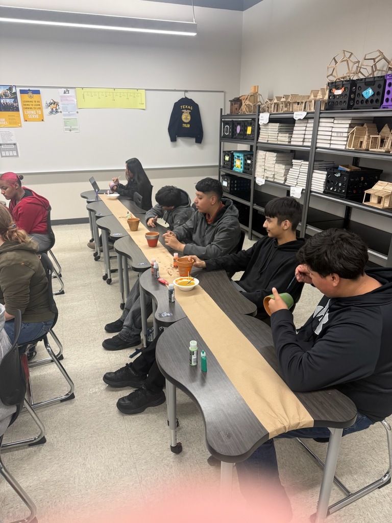 students painting flower pots