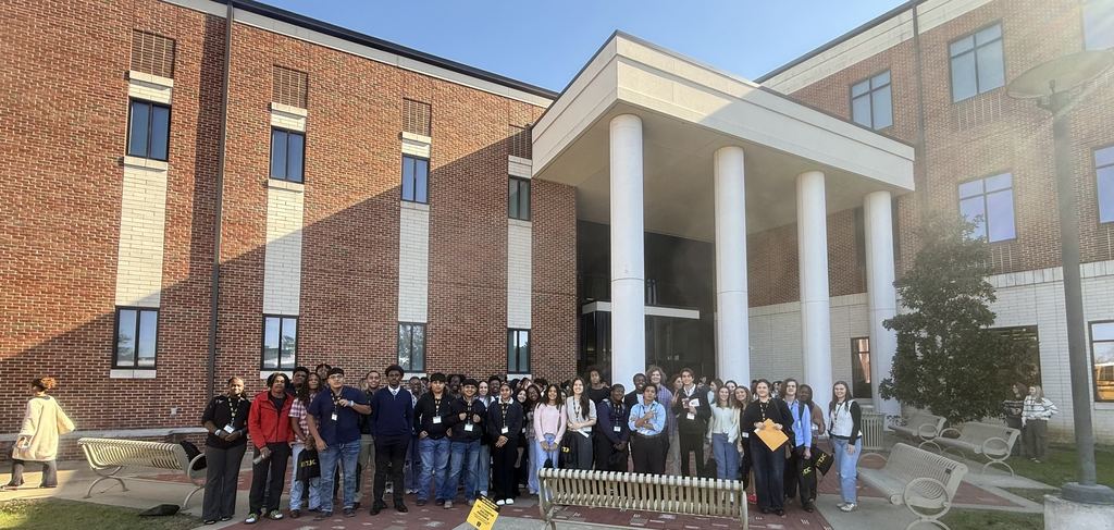 A large group of Tyler Legacy students in professional dress outside of TJC after their C4 event