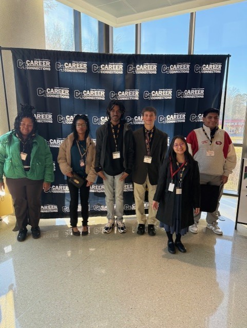 Tyler Legacy lifeskills students in front of a C4 background