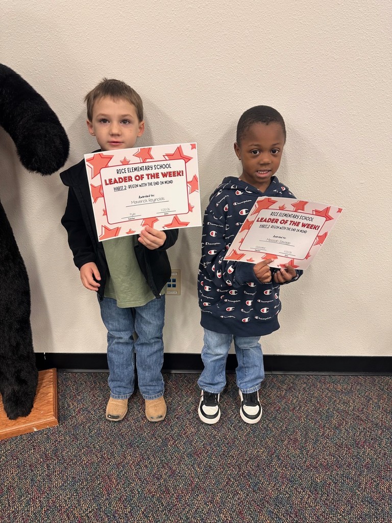 students holding certificates