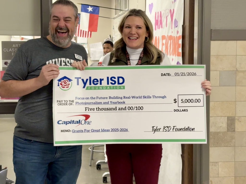 Mrs. Ford holding her grant check