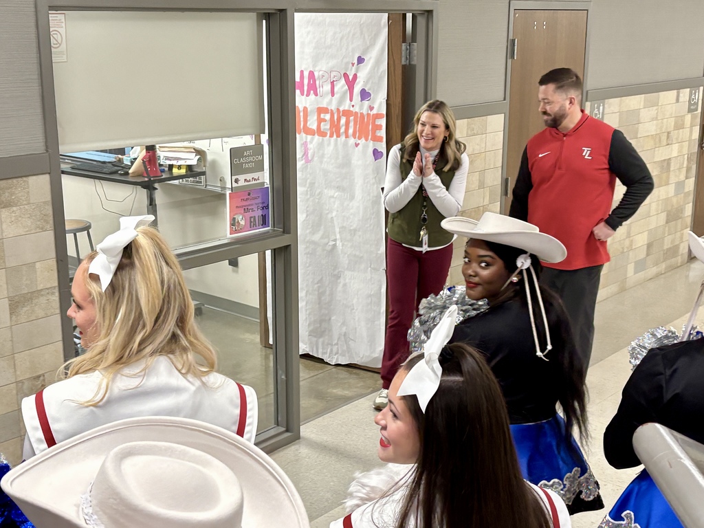 Mrs. Ford outside of her classroom excited about her grant