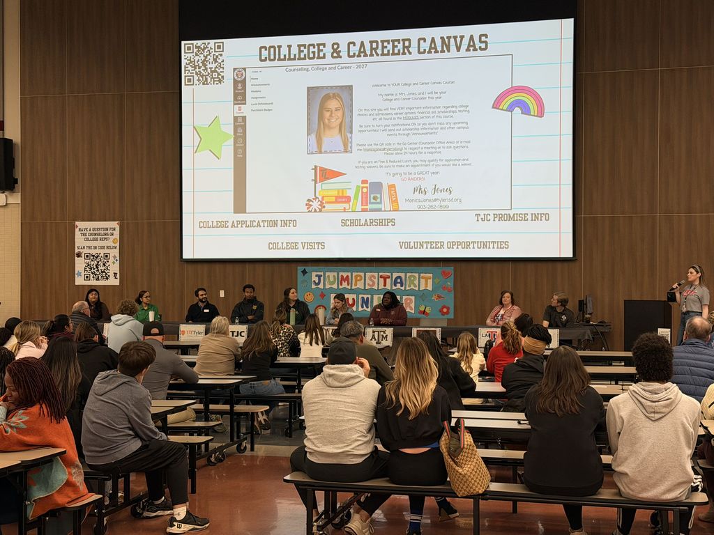 Tyler Legacy cafe during Jump start Junior Night. Families facing the stage with a presentation on the screen
