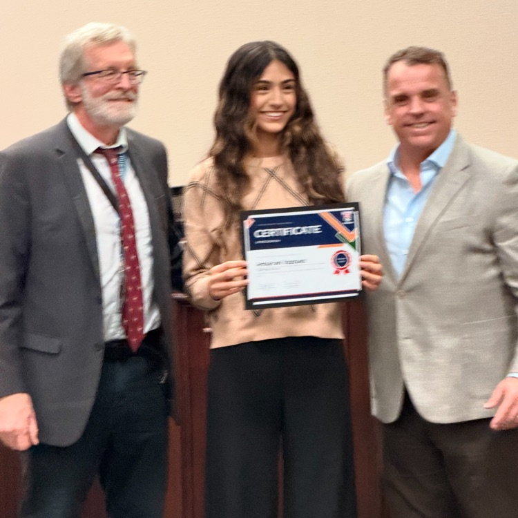student and teacher with certificate 