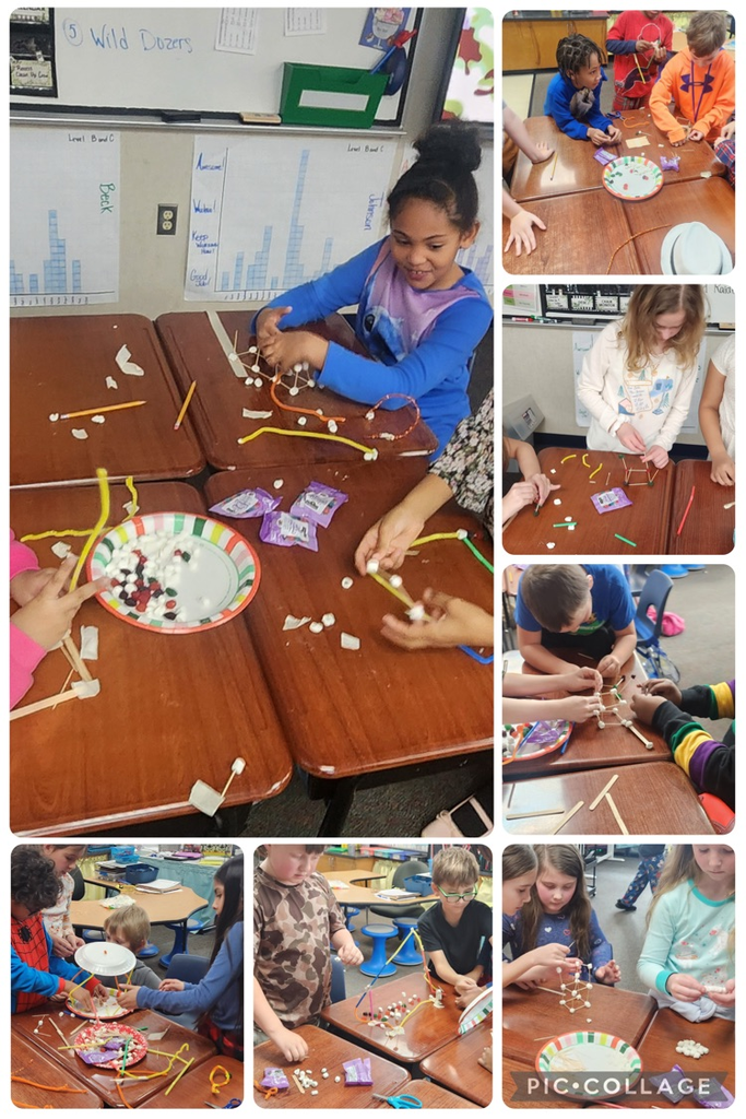 Students working in groups on a STEM project for the 100th day of school.