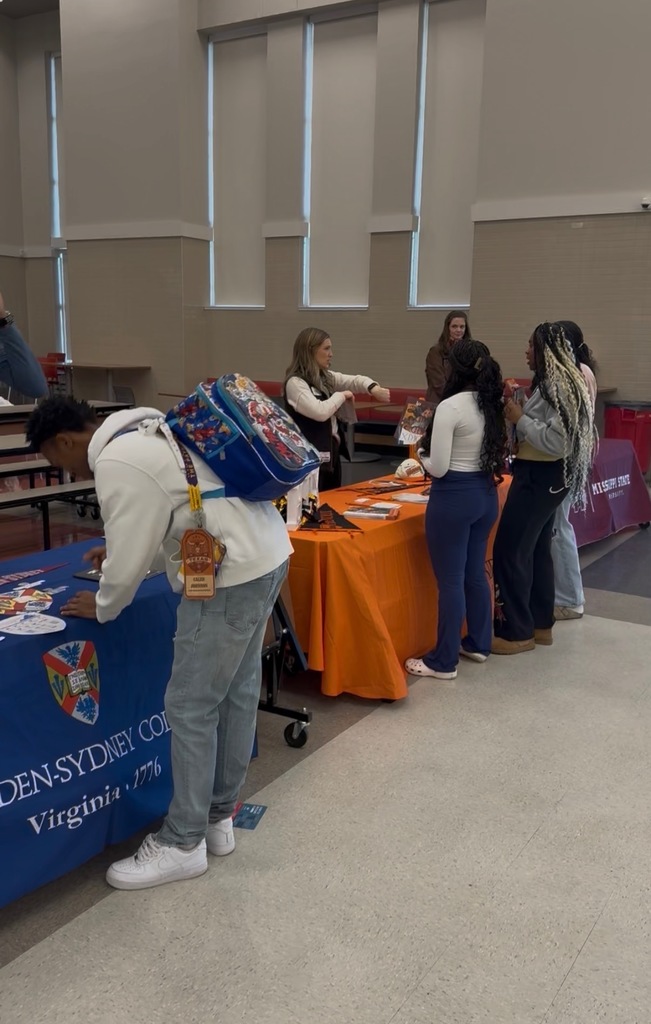 Tyler Legacy students talking to a college representative at the DARN college fair