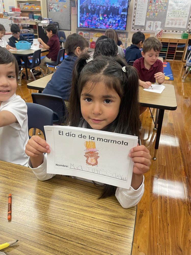 pre k student hold g book