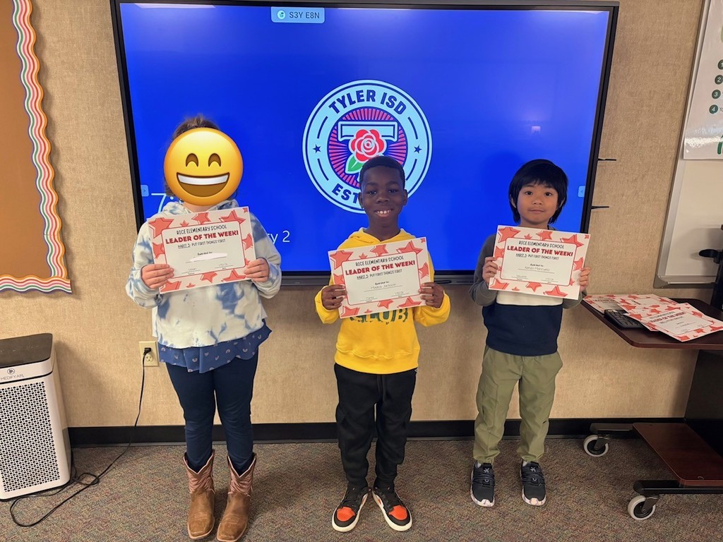 students holding certificates