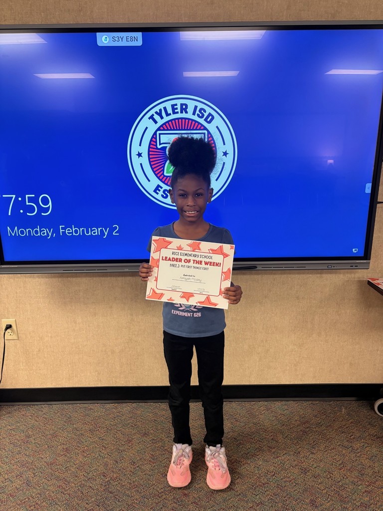 student holding a certificate