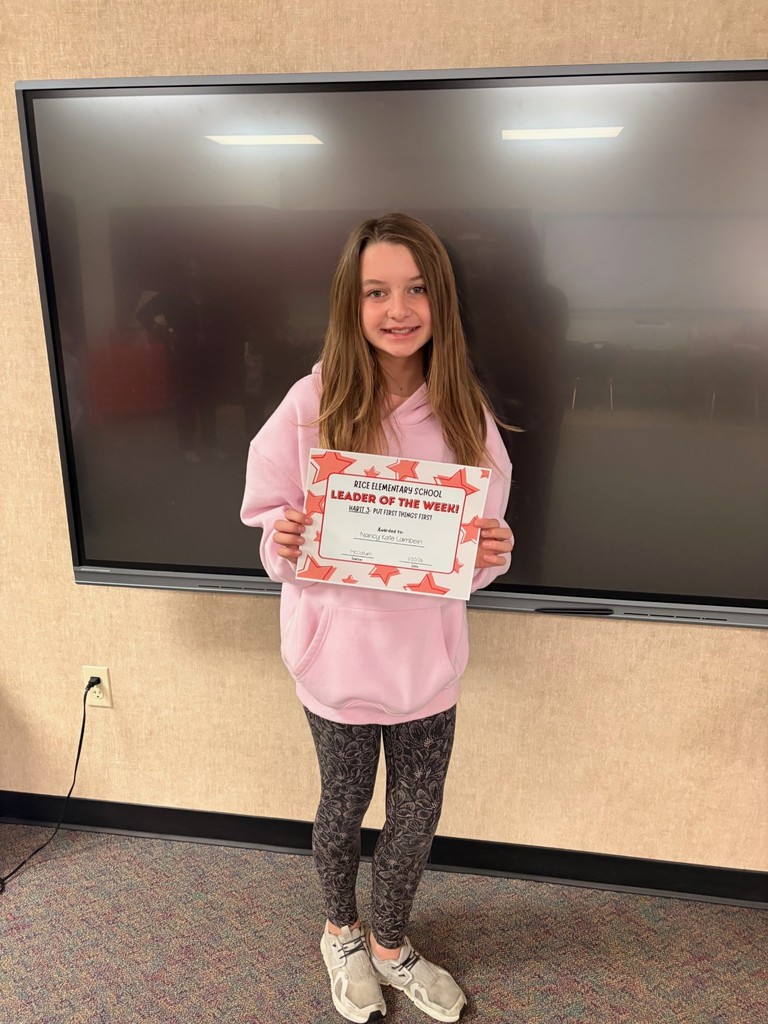 student holding a certificate
