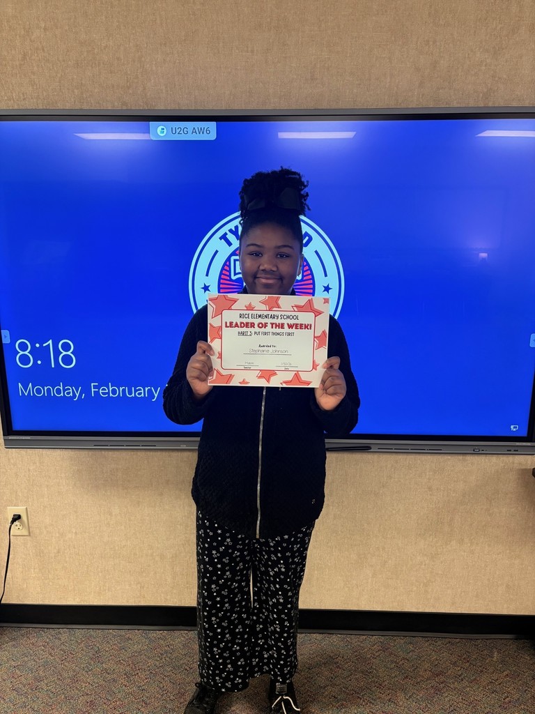 student holding a certificate