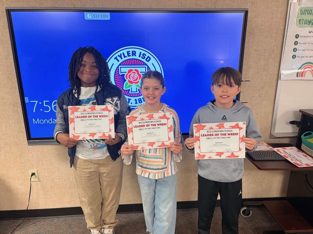 students holding certificates