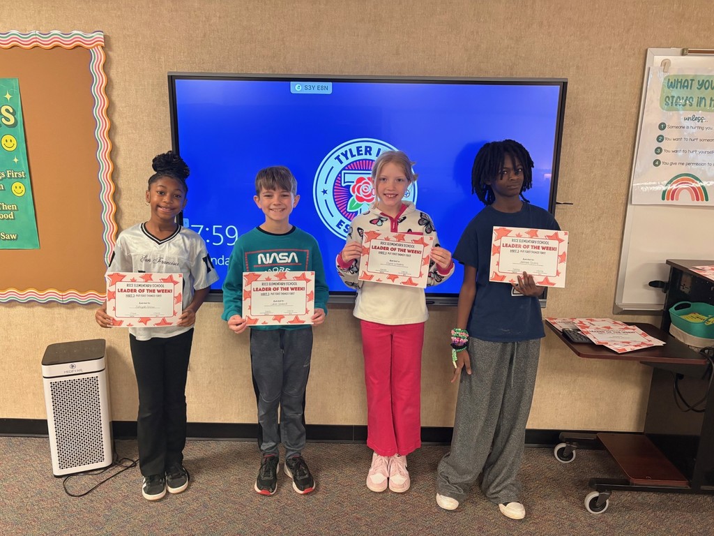 students holding certificates
