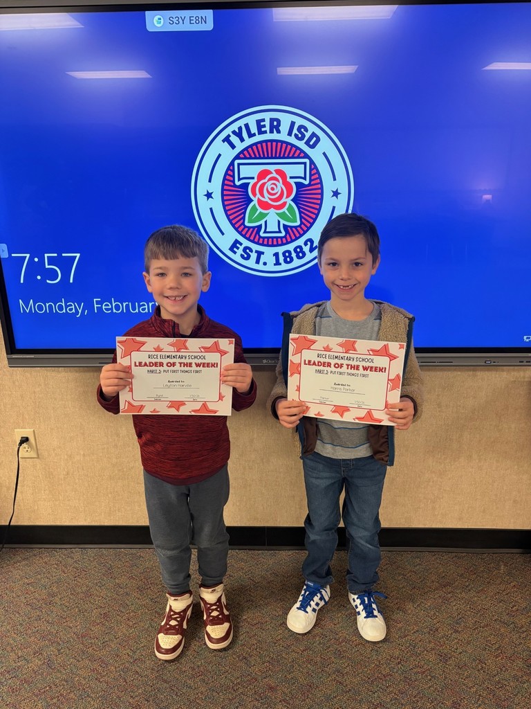 students holding certificates